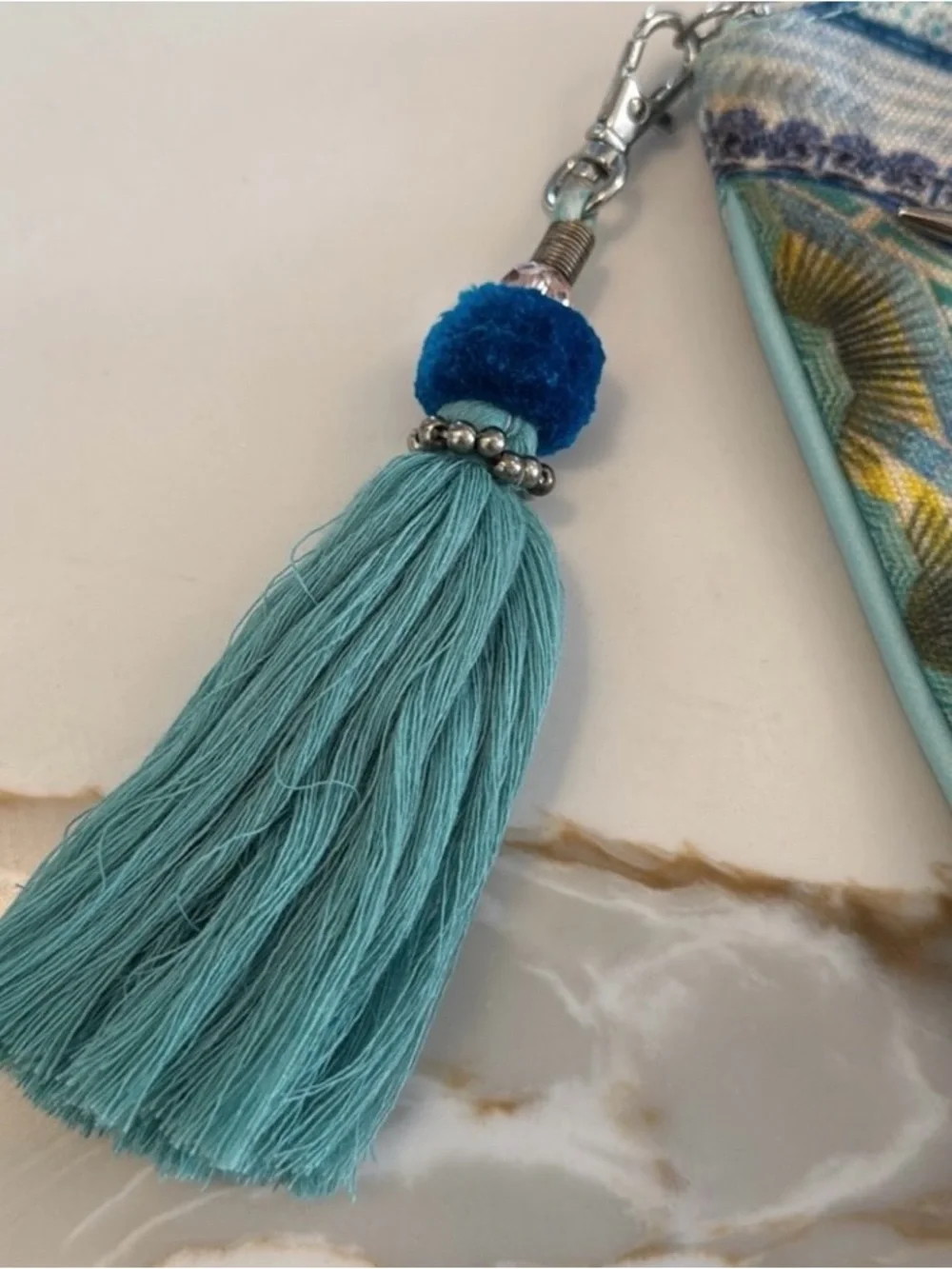 Camilla Shades of Rio Floral Blue-Green Canvas Tassel Clutch